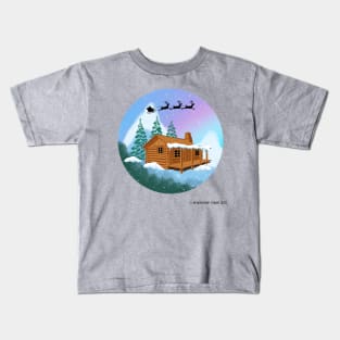 Santa and Reindeer Flying Over A Cabin in the Woods Kids T-Shirt